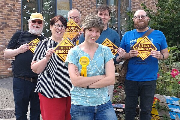 Marie French and the Norcot Lib Dems smiling outside the Dee Caf
