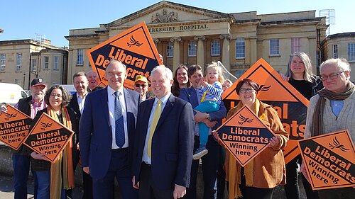 The Reading Lib Dems are joined by leader Sir Ed Davey MP and Wokingham MP Clive Jones outside the Royal Berkshire Hospital