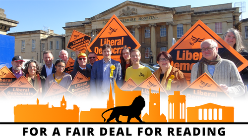 The Reading Lib Dem candidates cheering with placards outside the Royal Berkshire Hospital